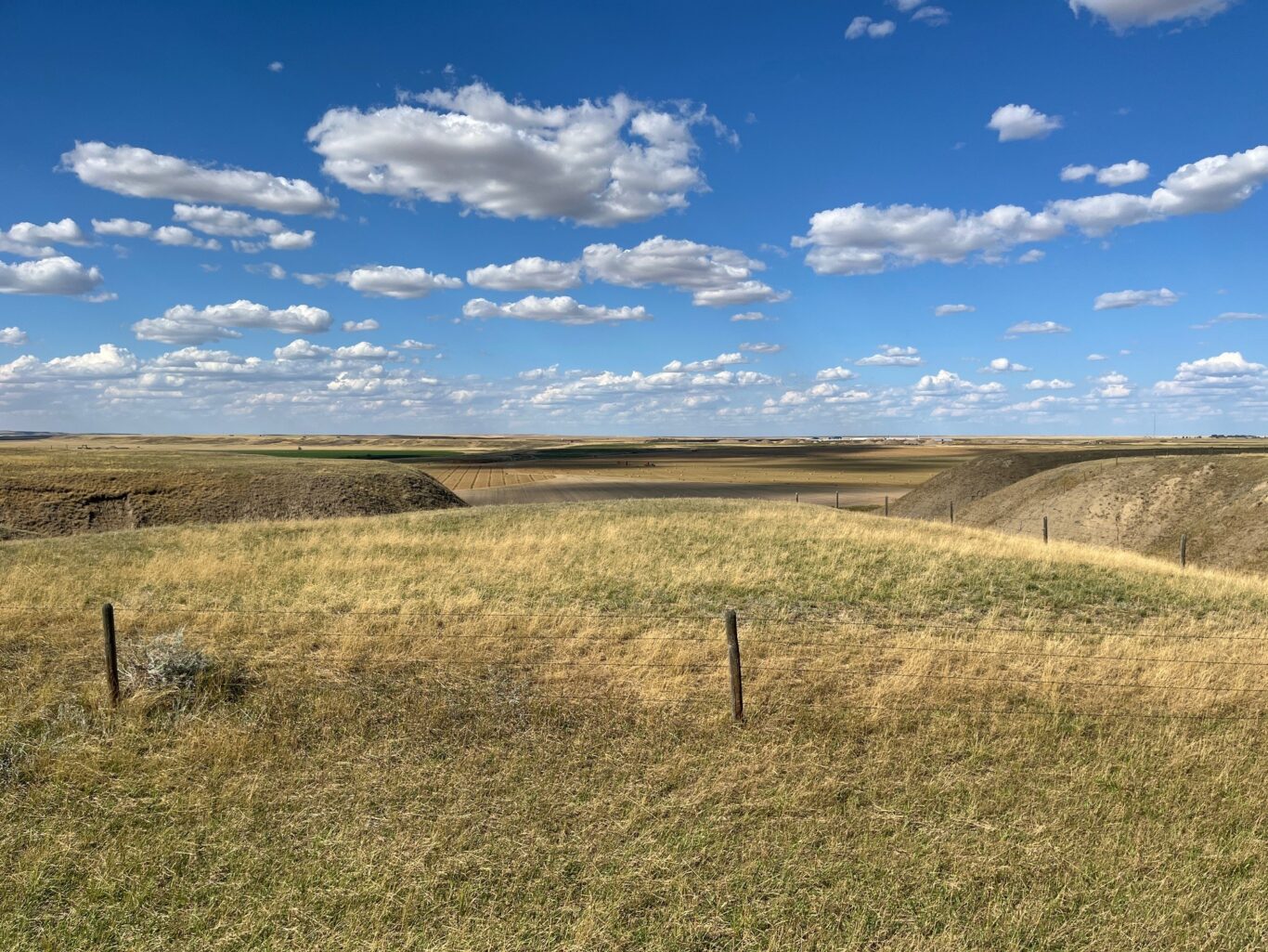 Big Bale Transtacker far away on Canadian Prairie